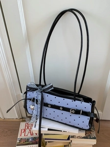 Blue striped baguette shoulder bag with black heart prints and grey mesh bow detail