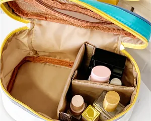 Detailed interior of the house-shaped makeup bag showing mesh pockets and dividers