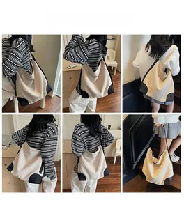 Multiple views of a cream canvas tote bag with black leather trim worn on the shoulder