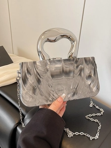 Artistic marble textured resin evening clutch bag with sculptural silver metal handle
