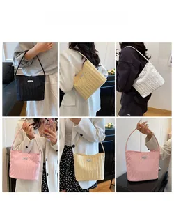 Detailed views of pleated cloud tote bag in black, yellow, white, and pink colors