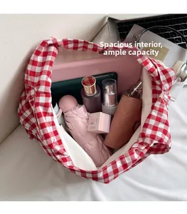 Top view of red plaid canvas tote bag showing large interior capacity for tablet and umbrella