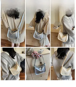 Detail showing beige crossbody bag with adjustable strap and metal lock in lifestyle setting