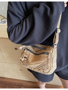 Vintage brown washed canvas crossbody bag with multi-pocket design and adjustable strap