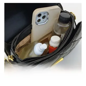 Detail view of the black quilted leather bag interior showing daily storage capacity