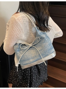 Large capacity denim shoulder bag with silver bow detail and metallic leather straps