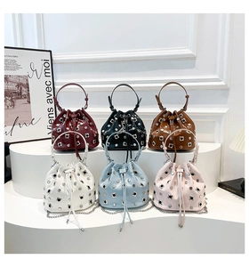 Studded bucket bags display in six colors featuring metallic patent leather and chains
