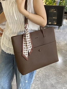 Dark brown pebble leather tote bag with houndstooth scarf and magnetic front pocket