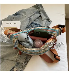 Colorful woven dumpling bag showing spacious capacity with umbrella, wallet and phone