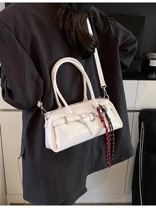 White casual crossbody Boston bag with decorative woven strap and metal buckle