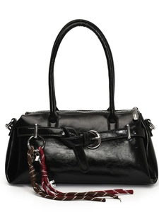 Minimalist black glossy handbag with shoulder straps and bohemian rope charm detail