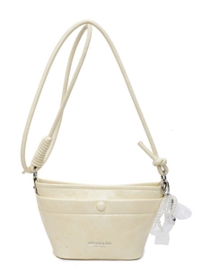 Beige PU leather crossbody bucket bag with knotted strap and pearl lace charm accessory