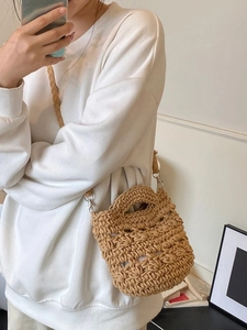 Minimalist hand-woven small bucket cross-body beach bag in light brown for women
