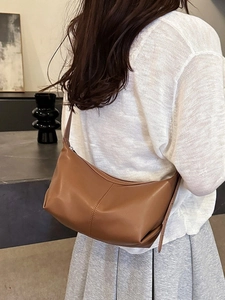 Retro brown leather crescent hobo bag for women with minimalist vertical stitching detail