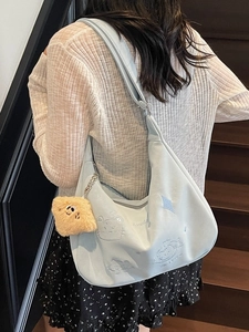 Light blue embroidered canvas shoulder bag with cute frog design and plush pendant
