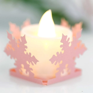 Pink snowflake hollow LED candle light with warm yellow glow for Christmas party decor