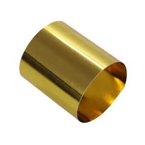 Macro detail of glossy golden napkin ring featuring a high-brightness mirror polished finish