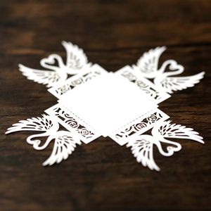 Detailed laser-cut white paper lantern featuring elegant swans and rose flower patterns