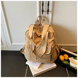 Detail of khaki nylon backpack with high-density fabric and magnetic flap pocket