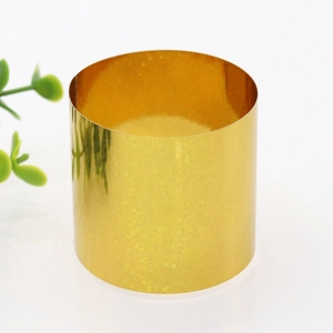Macro view of a cylindrical gold napkin ring with sparkling holographic texture