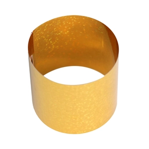 Macro detail of gold holographic napkin ring with shimmering laser glitter finish