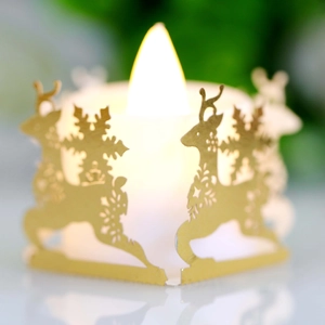 Christmas LED candle light with gold laser-cut deer and snowflake patterns for festive decor