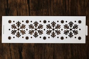 Macro detail of white snowflake hollow pattern template for Christmas candle holder decor