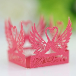 Detailed laser-cut magenta paper lampshade featuring hollow rose and swan heart patterns