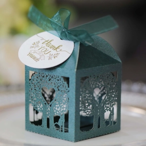 Laser-cut dark green wedding favor box with love tree patterns and silk ribbon bow