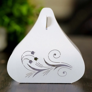 Elegant white laser-cut tulip candy box for weddings with intricate floral hollow pattern