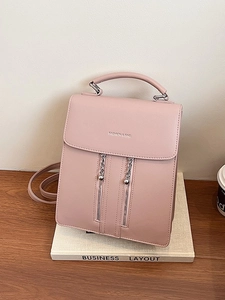 Morandi pink dual-use backpack with magnetic flap and metal chain ball pendant detail