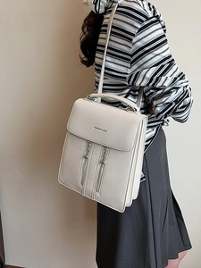 Chic cream white leather multi-way backpack for women featuring stylish vertical zippers