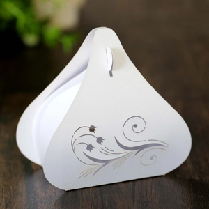 Detailed view of white tulip laser-cut hollow candy box with elegant floral patterns