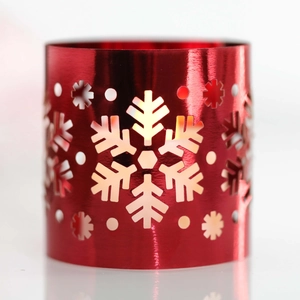 Detailed view of red metallic lantern with hollowed-out snowflake patterns and gloss finish
