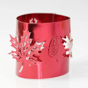 Detail showing red hollowed-out maple leaf metal design for festive atmosphere lamp