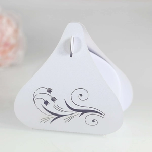 Detail of laser-cut tulip candy box with floral patterns for wedding and gift packaging