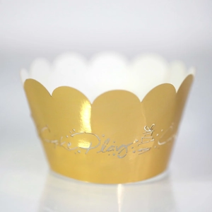 Detailed close-up of golden hollow cupcake wrappers with elegant wavy edges and logo