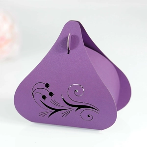 Detailed view of dark purple laser-cut tulip candy box with intricate floral patterns