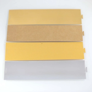 Detail of paper napkin rings with locking slots in assorted matte metallic colors