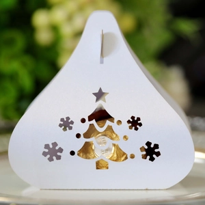White laser-cut Christmas tree and snowflake gift box for festive treats and candies