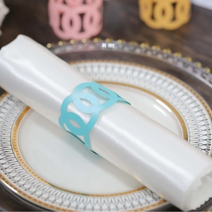 Light blue pearlized paper napkin ring with hollow geometric pattern for wedding decor