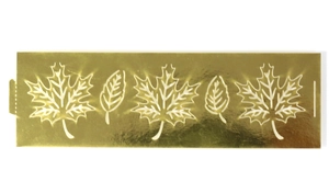 Macro shot of gold metallic maple leaf hollow-out decorative strip on white background