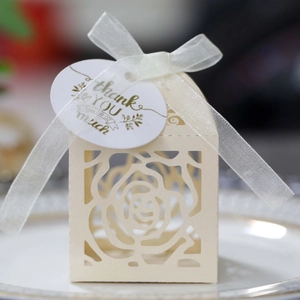 Detailed laser-cut rose hollow favor box with ivory ribbon and golden thank you tag