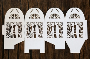 Detailed laser cut heart candy box with bride and groom silhouette for weddings