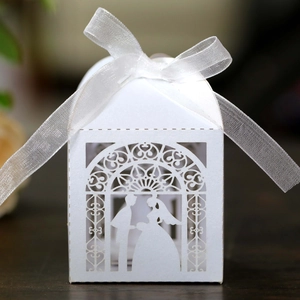 Detailed laser-cut bride and groom silhouette on white pearl paper wedding favor box