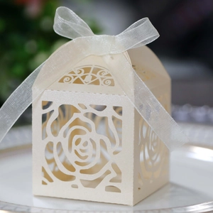 Elegant ivory laser-cut rose candy box with ribbon for wedding party favors