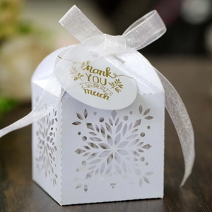 Detailed laser-cut snowflake hollow gift box with white ribbon and Thank You tag