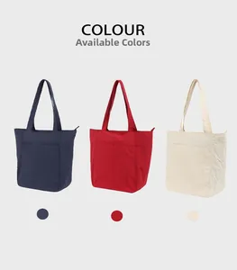 Vista frontale di grandi borse casual in blu navy, rosso e crema con tasche a zip