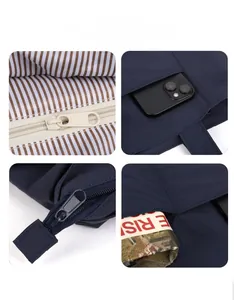Dettaglio borsa in tela blu navy con fodera a righe, zip in metallo e capacità di stoccaggio
