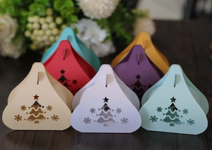 Detailed close-up of colorful hollow Christmas tree candy boxes in multiple festive colors